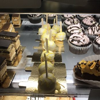NOSH - a display case with a variety of desserts - Desserts Near Me - Florence, Indiana