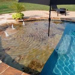 Triad PoolScapes - Walk-in with bubblers and umbrella.