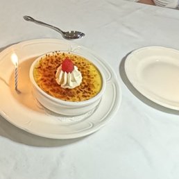 Classic Crème Brûlée- celebrating two birthdays and they added candles. This was a huge dessert and shareable! Classic Crème Brûlée- celebrating two birthdays and they added candles. This was a huge dessert and shareable!