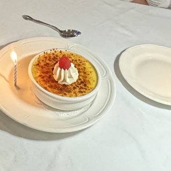 1852 Grill Room - Classic Crème Brûlée- celebrating two birthdays and they added candles. This was a huge dessert and shareable! - American Near Me - Mackinac Island, Michigan 1852 Grill Room - Classic Crème Brûlée- celebrating two birthdays and they added candles. This was a huge dessert and shareable! - American Near Me - Mackinac Island, Michigan