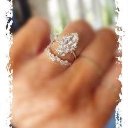 Melanie Casey - Melanie Casey's exquisite marquise Threaded Halo ring paired with her Snowdrift band.
