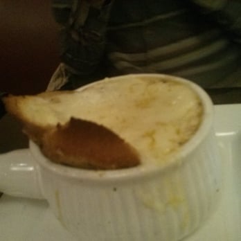 Harbord House - A french onion soup with a layer of cheese on top - Pubs Near Me - Toronto, Ontario Harbord House - A french onion soup with a layer of cheese on top - Pubs Near Me - Toronto, Ontario