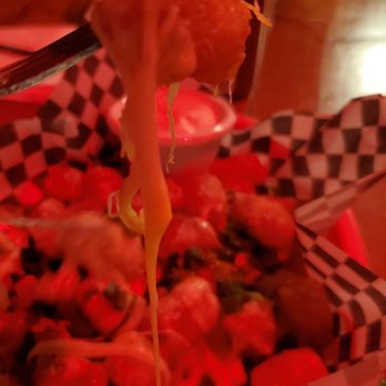 El Chupacabra - Close up of Tachos appetizer (under red light) - Mexican Near Me - Seattle, Washington