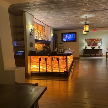 Onyx Bar & Lounge - a bar with a television in the background - New American Near Me - Scottsdale, Arizona Onyx Bar & Lounge - a bar with a television in the background - New American Near Me - Scottsdale, Arizona