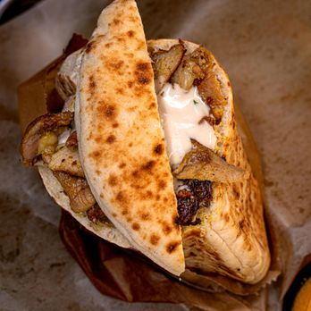 Hamitbach - a pita sandwich with a side of mustard - Wraps Near Me - San Diego, California