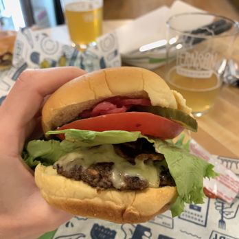 Fernson Brewing Company - a hand holding a hamburger - Beer Bar Near Me - Sioux Falls, South Dakota