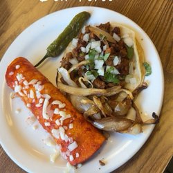 Carne asada taco and an enchilada