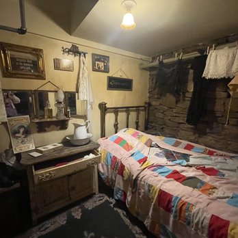 Wild Bill Bar - a bed with a quilt on it - Beer Bar Near Me - Deadwood, South Dakota Wild Bill Bar - a bed with a quilt on it - Beer Bar Near Me - Deadwood, South Dakota