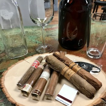 Craft'd - cigars and a bottle of wine on a table - Beer, Wine & Spirits Near Me - Morganton, North Carolina Craft'd - cigars and a bottle of wine on a table - Beer, Wine & Spirits Near Me - Morganton, North Carolina