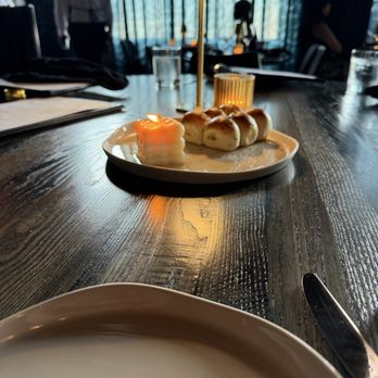 The Saint - Appetizer rolls and sunlight - Steakhouses Near Me - Dallas, Texas The Saint - Appetizer rolls and sunlight - Steakhouses Near Me - Dallas, Texas