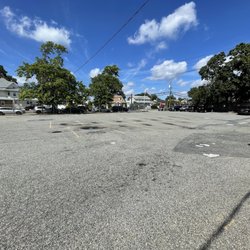 US Post Office - HUGE, EMPTY parking lot "For Postal Employees Only", good luck finding street parking.