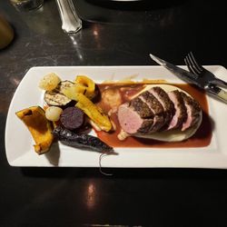 Rustik - Semi started eating duck breast, the. Took pic. Veggies we delicious. I devoured it.