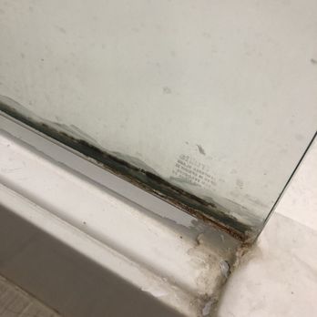 Courtyard by Marriott Hammond - This is the shower glass at the floor with mold and mildew - Hotels Near Me - Hammond, Louisiana