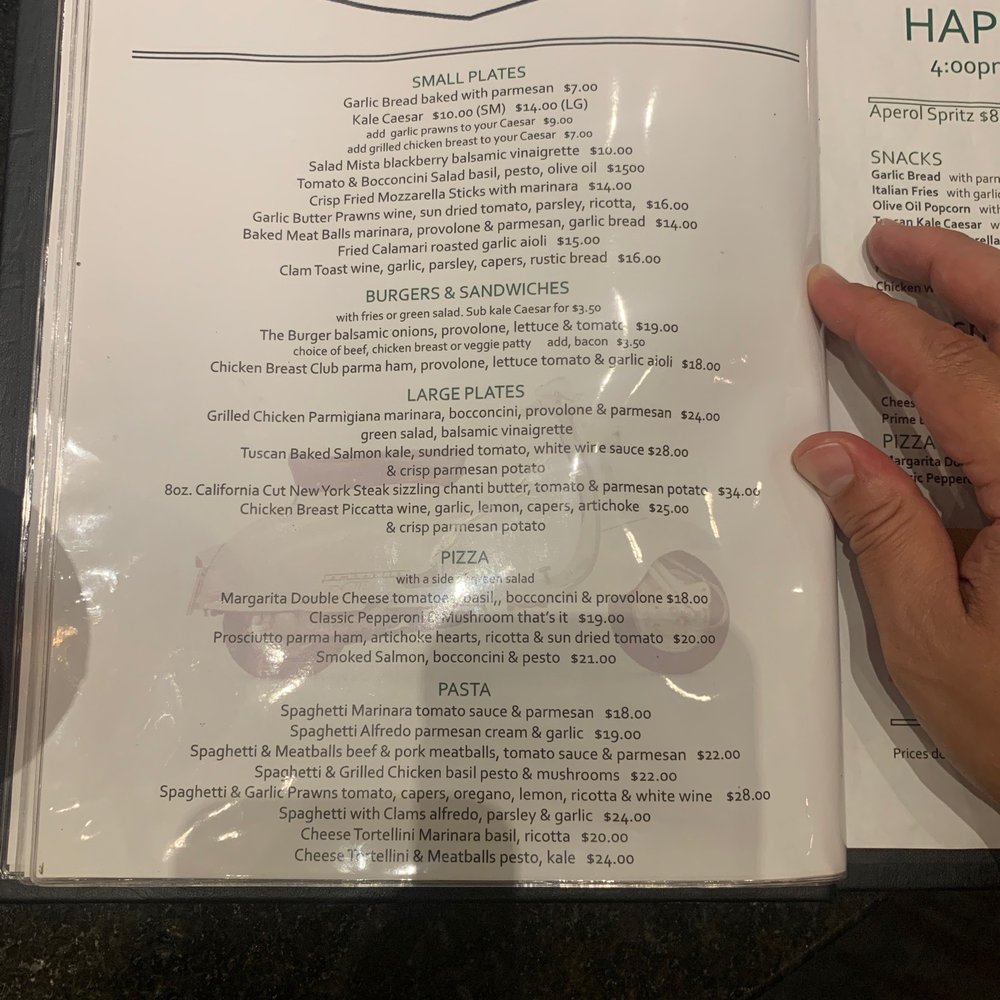 Mozza Restaurant & Lounge - a hand holding a menu - Canadian (New) Near Me - Richmond, British Columbia Mozza Restaurant & Lounge - a hand holding a menu - Canadian (New) Near Me - Richmond, British Columbia