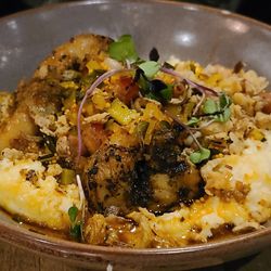Seneca - Shrimp & Grits w/ smoked gouda grits, house-smoked bacon, chorizo butter, zucchini and corn chow chow, & fried leeks.