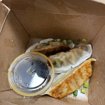 Wow Bao - a box of dumplings and a container of sauce - Food Delivery Services Near Me - Framingham, Massachusetts Wow Bao - a box of dumplings and a container of sauce - Food Delivery Services Near Me - Framingham, Massachusetts