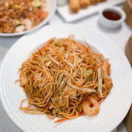 a plate of stir fried noodles a plate of stir fried noodles