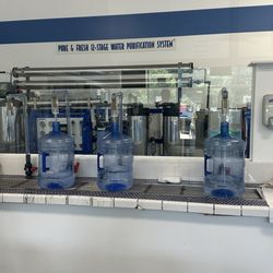 Purified Water To Go - Filling water bottles for Barefoot and Free Yoga Festival, at Proud Lake Recreation Park.