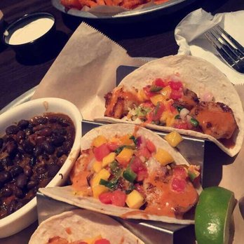 Taco Mac - Mango Shrimp Tacos w/ black beans Oven Roasted Wings w/ Sweet Potato Fries - Mexican Near Me - Chattanooga, Tennessee Taco Mac - Mango Shrimp Tacos w/ black beans Oven Roasted Wings w/ Sweet Potato Fries - Mexican Near Me - Chattanooga, Tennessee