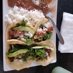 La Pasadita - Beef tacos with avocado, cilantro, onion and spicy red and green sauces