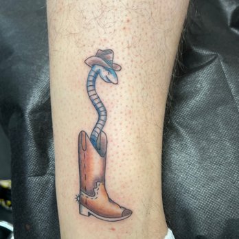 Vaztro Tattoos - Snake in a boot tattoo by Milly - Tattoo Near Me - Clearwater, Florida