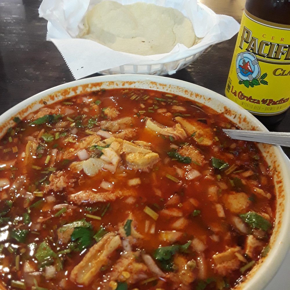Menudo.  I add a bunch of heat and fixin's from their salsa bar.  $9.99 deal $2 beer