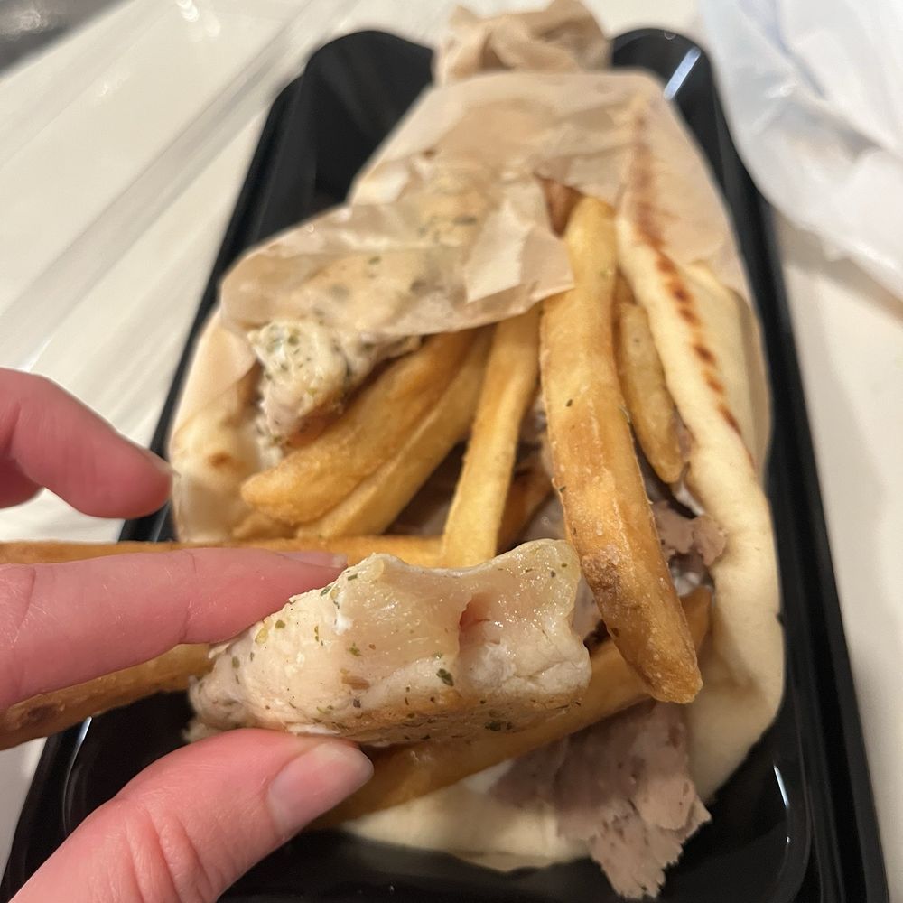Raw chicken souvlaki in gyro