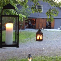 Full Moon Farm - Lanterns lit for a romantic dinner in the barn at a May wedding.