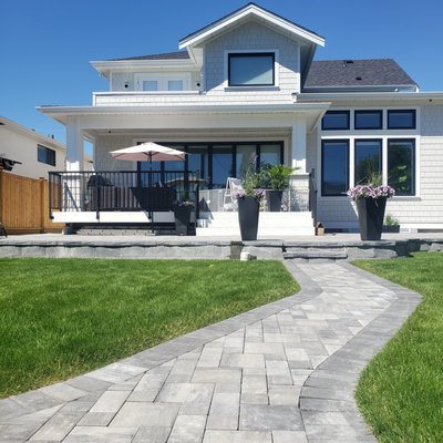 Backyard Design + Remodel - Backyard transformation with stone paths, raised beds, and concrete steps
