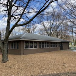 Covered shelter with screen windows