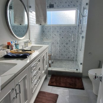 World Of Tile - a bathroom with a shower, sink, and toilet - General Contractors Near Me - Fairfax, Virginia World Of Tile - a bathroom with a shower, sink, and toilet - General Contractors Near Me - Fairfax, Virginia
