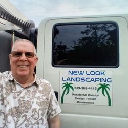 New Look Landscaping - 2024 - Double crew cab truck with 14 foot dump bed and tool boxes.