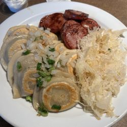 Yogi's Ranger Station / Prawda Shell - Ukrainian Dish $18.99. Includes perogis, sausage and cabbage.