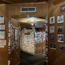 Cock of the Walk - Business cards on the walls as you walk down the hall to good food but poor management