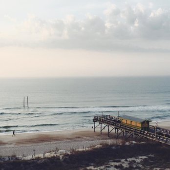 Golden Sands Carolina Beach Oceanfront Tapestry by Hilton - Sunrise on the tikki bar - Hotels Near Me - Carolina Beach, North Carolina Golden Sands Carolina Beach Oceanfront Tapestry by Hilton - Sunrise on the tikki bar - Hotels Near Me - Carolina Beach, North Carolina