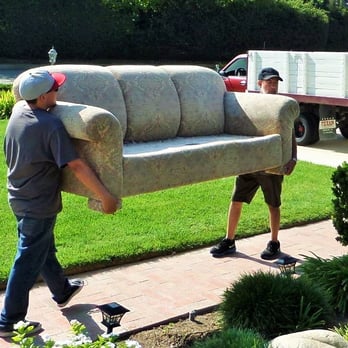 Churik Upholstery - Cesar and helper carrying sofa out to his truck. - Furniture Reupholstery Near Me - Camarillo, California