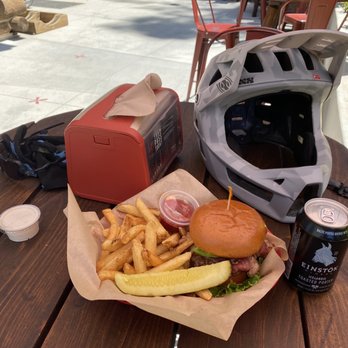 The Pedal Pub - a burger and fries on a picnic table - Pubs Near Me - Skyforest, California