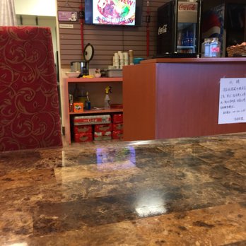 Dancing Noodle - a restaurant counter with a sign on it - Chinese Near Me - Winnipeg, Manitoba