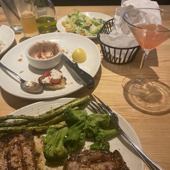 Carrabba's Italian Grill - The remains of our appetizer and look at my Pork Chops - Italian Near Me - Collierville, Tennessee Carrabba's Italian Grill - The remains of our appetizer and look at my Pork Chops - Italian Near Me - Collierville, Tennessee