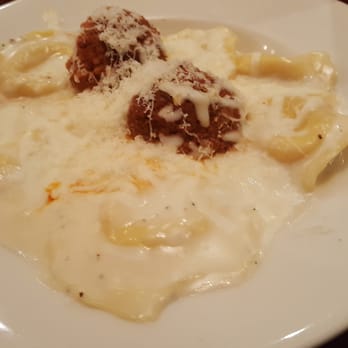 Johnny Carino's - Four cheese raviolis w/ alfredo sauce and meatballs. Meatballs were terrible. Raviolis were ok. Sauce was too greasy. - Italian Near Me - Downey, California