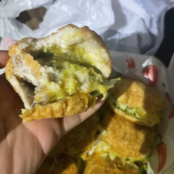 Paulinas Badlands Bar and Grill - a hand holding a half eaten sandwich - Bars Near Me - El Paso, Texas Paulinas Badlands Bar and Grill - a hand holding a half eaten sandwich - Bars Near Me - El Paso, Texas