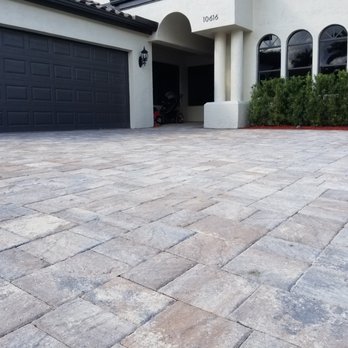 Terra Pavers - a driveway with a garage door - General Contractors Near Me - Boca Raton, Florida