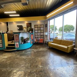Well Wishes Tattoo - Clean, colorful, vibrant lobby! The colors match their storefront sign!