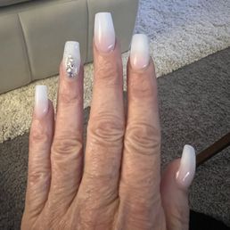 Pink-white tip ombre, coffin shape, medium length, with some bling on the ring finger. LVE my nails. They always do a great job. Pink-white tip ombre, coffin shape, medium length, with some bling on the ring finger. LVE my nails. They always do a great job.