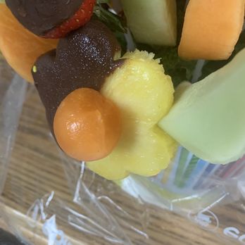 Edible Arrangements - Completely "not" bitten melon center - Chocolatiers & Shops Near Me - Babylon, New York