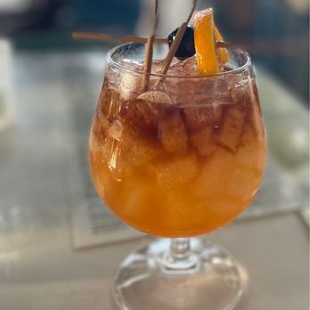 Lucky Shuck - STORM'S BREWIN' Aged Rums, Passion Fruit, Lime, Local Honey, Pomegranate, Dark Rum Float. - Seafood Near Me - Jupiter, Florida