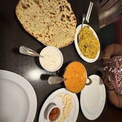 Koyla Indian Restaurant - Chicken biryani, Raita shrimp tikka masala, aaloo paratha and papad with salsa. The Lassi mango drink was so good.