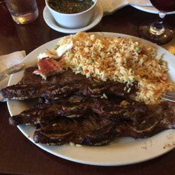 El Nandu Restaurant - The ribs with rice. The bf gave me a piece if his breaded chicken to try ( on the left corner) - Latin American Near Me - Chicago, Illinois El Nandu Restaurant - The ribs with rice. The bf gave me a piece if his breaded chicken to try ( on the left corner) - Latin American Near Me - Chicago, Illinois