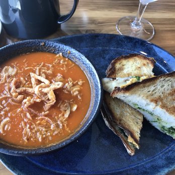 Water's Table - Grilled Kimcheese and Coconut Tomato Soup. We swapped the kimchee for pesto. - New American Near Me - Renton, Washington