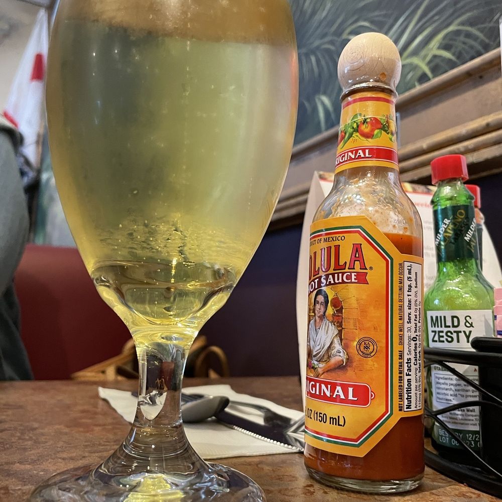 Annie's Cafe - Temecula - Look at the size of this mango mimosa next to the regular bottle of Cholula - Breakfast & Brunch Near Me - Temecula, California Annie's Cafe - Temecula - Look at the size of this mango mimosa next to the regular bottle of Cholula - Breakfast & Brunch Near Me - Temecula, California